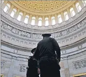  ?? REUTERS ?? Police officers stand in the Rotunda at the US Capitol in Washington, DC on Friday.