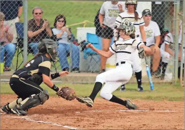  ?? Jeremy Stewart /
Rome News-Tribune ?? Pepperell’s Dahlia Sanford (right) starts to slide into home as Rockmart’s Taylor Camp waits on the throw during the second inning of a Region 7-AA game.