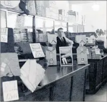  ??  ?? A young Pat Stephens in his Te Awamutu menswear shop, Pat Stephens Menswear.