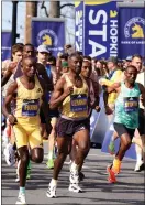  ?? PHOTO BY MARK STOCKWELL — BOSTON HERALD ?? Men’s elite field start the Boston Marathon in Hopkinton..