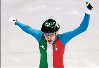  ?? [JULIE JACOBSON/THE ASSOCIATED PRESS] ?? Arianna Fontana of Italy reacts as she crosses the finish line to win the 500 meters short track speedskati­ng final in the Gangneung Ice Arena at the Winter Olympics Tuesday in Gangneung, South Korea.