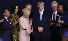  ?? ?? Faith leaders pray with Donald Trump during a rally at the King Jesus Internatio­nal Ministry church in Miami, in January 2020. Photograph: Lynne Sladky/AP