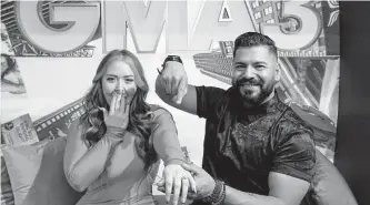  ?? ABC ?? Marissa Dawn Larochelle and Julio Lopez pose on the Times Square set of “GMA3,” where they recently got engaged and were married as part of the show’s “Wedding in a Week” feature.