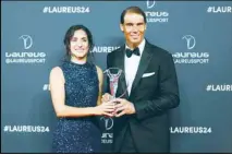  ?? ?? Spanish tennis player Rafael Nadal and Maria Francisca Perello pose for the media after winning “Sport for good 2024” at the Laureus Sports Awards ceremony in Madrid. (AP)