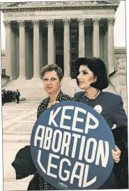  ?? ?? BOTH SIDES: Norma McCorvey, a k a “Jane Roe,” is joined by her attorney, Gloria Allred, outside the Supreme Court in 1989 (left) and attends an anti-abortion rally in Dallas with a 9-year-old friend in 1997 (right).