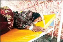  ?? (AFP) ?? An elderly Yemeni woman suspected of being infected with cholera receives treatment at a makeshift hospital in Sanaa on June 5. Yemen is descending into total collapse, its people facing war, famine and a deadly
outbreak of cholera, as the world...