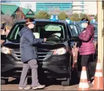  ?? Dan Haar /
Hearst Connecticu­t Media ?? Community Health Center Inc. opened the state’s first and largest large-scale outdoor COVID-19 vaccinatio­n clinic Jan. 17 on a runway at the long-retired Pratt & Whitney airport at Rentschler Field in East Hartford.