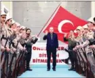  ?? MUHURDAR /AFP MURAT CETIN ?? Turkey’s President Recep Tayyip Erdogan (centre) on Sunday hit out at Germany for what he called ‘Nazi practices’.