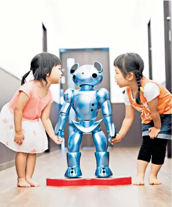  ??  ?? A robot called Vevo is being introduced into nurseries in Japan where it can recognise and greet children – and cover staff shortages