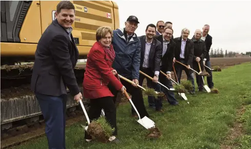  ?? Leah Gerber ?? An official sod-turning ceremony Monday morning kicked off constructi­on of the new Wellesley Township Recreag ti ioK n- Ce ee nu tQ r- ee Tb ho oD s- en taking part included Wellesley rec. director Danny Roth, regional Chair Karen Redman, Wellesley Mayor Joe Nowak, Kitchener-Conestoga MPP Mike Harris, capital campaign chair Chris Martin, Cam Ball and Brendon Aiken of Ball Constructi­on, Matthew Delean and Albert Paquette of Architectu­re 49 and Wellesley CAO Rik Louwagie.