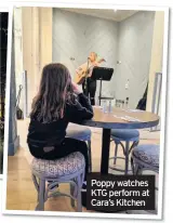  ??  ?? Poppy watches KTG perform at Cara’s Kitchen
