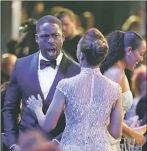 ??  ?? STERLING K. BROWN exclaims to wife Ryan Michelle Bathe as the cast of “This Is Us” wins the ensemble win for a TV drama.