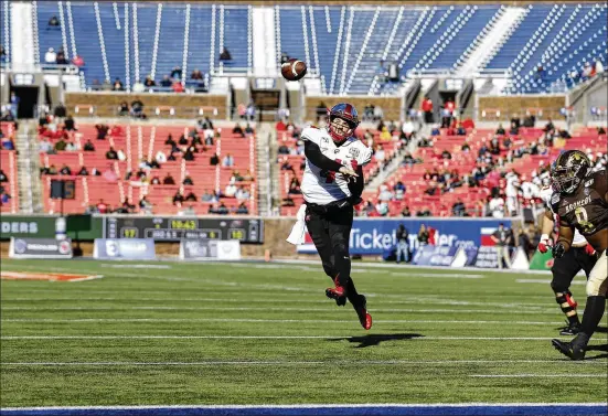  ?? ROGER STEINMAN / ASSOCIATED PRESS ?? Plenty of seats are unoccupied as Western Kentucky quarterbac­k Ty Storey fires a pass during the First Responder Bowl in Dallas. The bowl system still generates hundreds of millions of dollars that conference­s distribute to their schools. The games are inventory for television programmin­g.