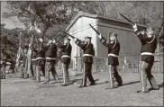  ?? Doug Walker, File ?? The Shanklin- Attaway Post 5 American Legion Honor Guard fires the traditiona­l 21-gun salute during Veterans Day services in Myrtle Hill Cemetery on Nov. 11, 2019.