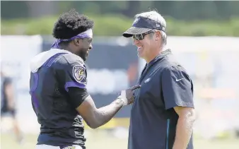  ?? /MATT ROURKE/AP ?? Ravens quarterbac­k Robert Griffin III, left, and Eagles coach Doug Pederson meet during a joint practice Monday in Philadelph­ia. .