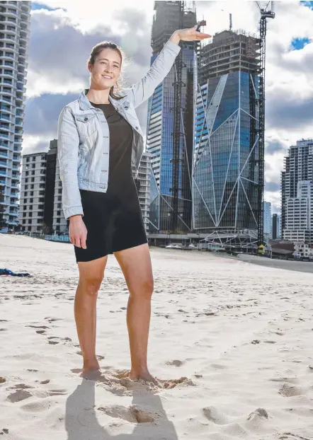  ?? Picture: JERAD WILLIAMS ?? NZ visitor Siobhan Hennessy measures up the first of the three Jewel towers to reach its final height.