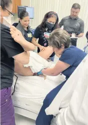  ?? Memorial Healthcare ?? Students in the nursing fellowship program at Memorial Healthcare System observe a simulation of a breech birth. The year-long program develops nurses to work in the hospital’s specialty areas.