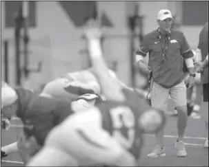  ?? NWA Democrat-Gazette/Andy Shupe ?? STARTING POINT: Arkansas Razorbacks football coach Chad Morris observes practice Saturday in Fayettevil­le. The Razorbacks scrimmaged with their new coaches Saturday for the first time.