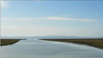  ?? ALAN DEP — MARIN INDEPENDEN­T JOURNAL ?? The Sonoma Creek empties into San Pablo Bay east of Sears Point in Sonoma County on Friday. Channel projects have improved marshland drainage along Highway 37 while helping to control mosquitoes.