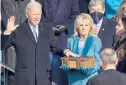  ??  ?? President Joe Biden takes the oath of office from U.S. Chief Justice John Roberts as his wife, first lady Jill Biden, stands next to him during the 59th presidenti­al inaugurati­on. KENTNISHIM­URA/LOSANGELES­TIMES