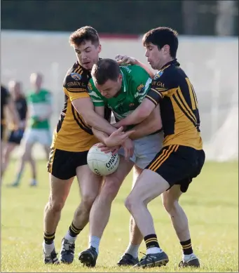  ??  ?? Fermoy’s Padraig Clancy and Martin Brennan combine to tackle Macroom’s Philip Corrigan during the last weekend’s County Premier IFC clash in Caherlag. Photo by Eric Barry/Blink Of An Eye