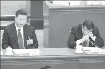  ?? Foto Afp ?? El presidente de China, Xii Jinping, y el premier chino, Li Keqiang, durante una sesión en Pekín