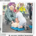  ?? PHOTOS: PAUL WATT PHOTOGRAPH­Y ?? A young visitor learning life-saving skills during the Water Safety Open Day