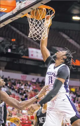  ?? L.E. Baskow Las Vegas Review-journal @Left_eye_images ?? Minnesota interior presence Naz Reid dunks on his way to a team-high 20 points, six rebounds and three blocks in Sunday’s semifinal victory over Brooklyn.