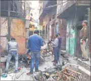  ?? ABHISHEK DEY/HT PHOTO ?? SDMS noted details of damage to properties they came across, n often navigating about with the help of neighbours whose houses were not touched by violent mobs.