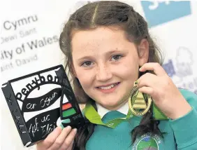  ??  ?? > Lena Haf Davies, from Bro Cernyw school, who won the Cerdd Dant solo Year 5 and six