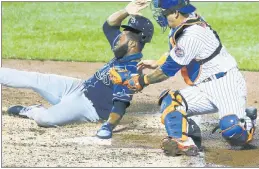  ?? Getty Images ?? THERE’S NO STOPPING HIM: Manuel Margot slides under the tag of Wilson Ramos on a fielder’s choice during the third inning of the Mets’ 8-5 loss to the Rays.