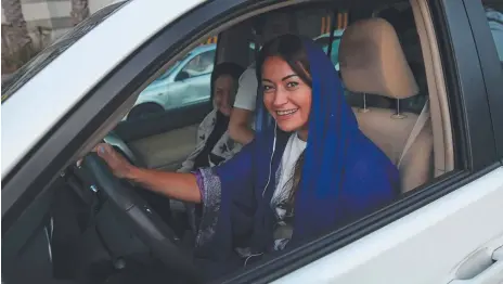  ?? Picture: GETTY ?? A young woman drives a car in Jeddah, Saudi Arabia on Sunday – the first day she was legally allowed to drive.