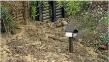  ?? ?? The occupants of this property in Moana Ave face a slog to get their mail through piles of mud left by a slip.