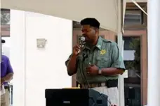  ?? (Caitlan Butler/News-Times) ?? Capt. Eric Meadows since “Go Rest High on the Mountain” during the 2023 Community Wall unveiling ceremony on Thursday.