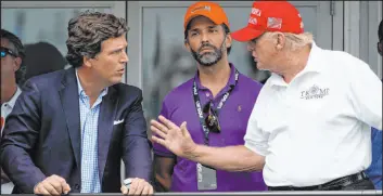  ?? Seth Wenig
The Associated Press file ?? Former President Donald Trump, right, talks with Donald Trump Jr., center, and Tucker Carlson at the Bedminster Invitation­al LIV Golf tournament in Bedminster, N.J., on July 31. Thousands of hours of surveillan­ce footage from the Jan. 6, 2021, Capitol attack have been made available to Carlson, a Fox News Channel host.