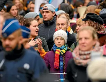  ?? AP ?? Greta Thunberg takes part in yesterday’s climate change protest in Brussels. The government­s of Poland, Hungary and the Czech Republic – all heavy users of fossil fuels to generate electricit­y – are trying to depict the Swedish climate activist as a danger to the world.