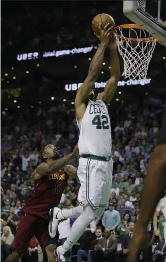  ?? CHARLES KRUPA — THE ASSOCIATED PRESS ?? JR Smith shoves Celtics forward Al Horford as Horford drives to the basket during the second half in Game 2 of the Eastern Conference finals May 15 in Boston. Smith was called for a flagrant foul.