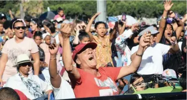  ?? COURTNEY AFRICA African News Agency (ANA) ?? CROWDS cheer on performers at 50th annual Festive Lights Switch-On. Thousands of people gathered on the Grand Parade to enjoy a free concert before the official turning on of the lights |