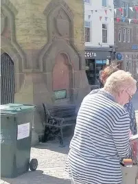  ?? Our West Lancashire campaigner­s against the green bin charge at Ormskirk Clock Tower ??