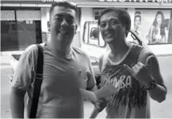  ??  ?? Father of Gio Paolo Peralta the first and long-time child beneficiar­y who undergo liver surgery transplant received the financial assistant from Body Fixed Crew member and Zumba Instructor Jomar Sison.