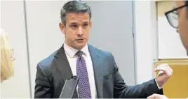  ?? ANTONIO PEREZ/CHICAGO TRIBUNE ?? U.S. Rep. Adam Kinzinger speaks with the media before attending a gun violence hearing in 2019 at Kennedy-King College in Chicago.