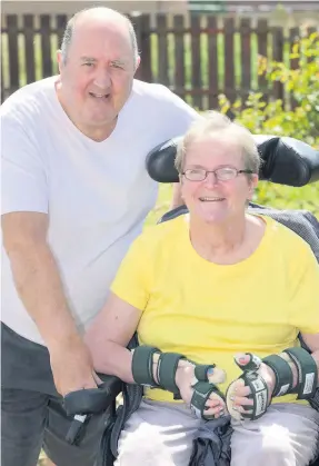  ??  ?? Daring challenge Brave Margaret Ferry will do her charity glide tomorrow. She is pictured with husband Patrick