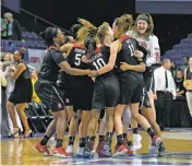  ?? TIMOTHY D. EASLEY/THE ASSOCIATED PRESS ?? Members of the Stanford team celebrate after defeating Notre Dame to win the Lexington regional final of the women’s NCAA Tournament on Sunday in Lexington, Ky.