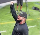  ?? ISAAC BREKKEN/AP ?? Raiders coach Jon Gruden celebrates (without his mask) after defeating the Saints Monday.