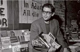  ?? Joe Rosenthal/The Chronicle ?? Allen Ginsberg with an array of books, including Jack Kerouac’s “Doctor Sax” and his own poetry collection, “Howl,” in 1959.