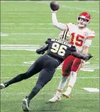  ?? Chris Graythen / Getty Images ?? Kansas City QB Patrick Mahomes throws a TD pass under pressure by New Orleans’ Carl Granderson in the Chiefs’ 32-29 victory. Mahomes threw for three TDs.