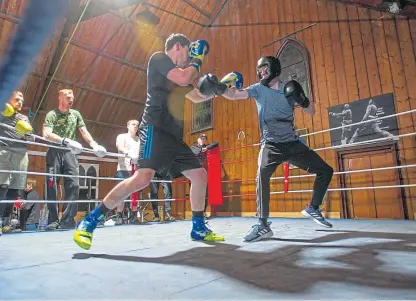  ?? Picture: Kim Cessford. ?? A sparring session at Brechin Boxing Club is watched keenly by fellow fighters.