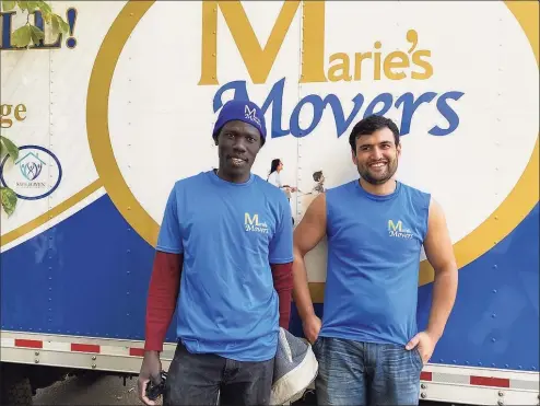  ?? Mary O’Leary / For Hearst Connecticu­t Media ?? Above and below, Anur Abdemma, left, from Sudan and Jarvid, an Afghan who arrived from Turkey, are now living in Connecticu­t and working for Marie’s Movers, helping other refugees.