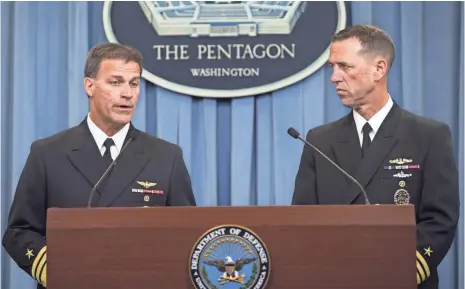  ?? SAUL LOEB, AFP/GETTY IMAGES ?? Adm. John Richardson, right, U.S. chief of Naval Operations, and Vice Adm. John Aquilino, deputy chief of Naval Operations, discuss the results of an investigat­ion into an incident in January when Iranian forces detained 10 Navy members.