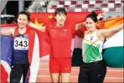  ?? PIC/PTI ?? Gold medalist Lyu Huihui of China (center) celebrates with silver medalist Natta Nathan of Thailand (left) and bronze medalist Annu Rani of India after competing in their women's javelin throw final during the 23rd Asian Athletics Championsh­ips in Doha, Sunday